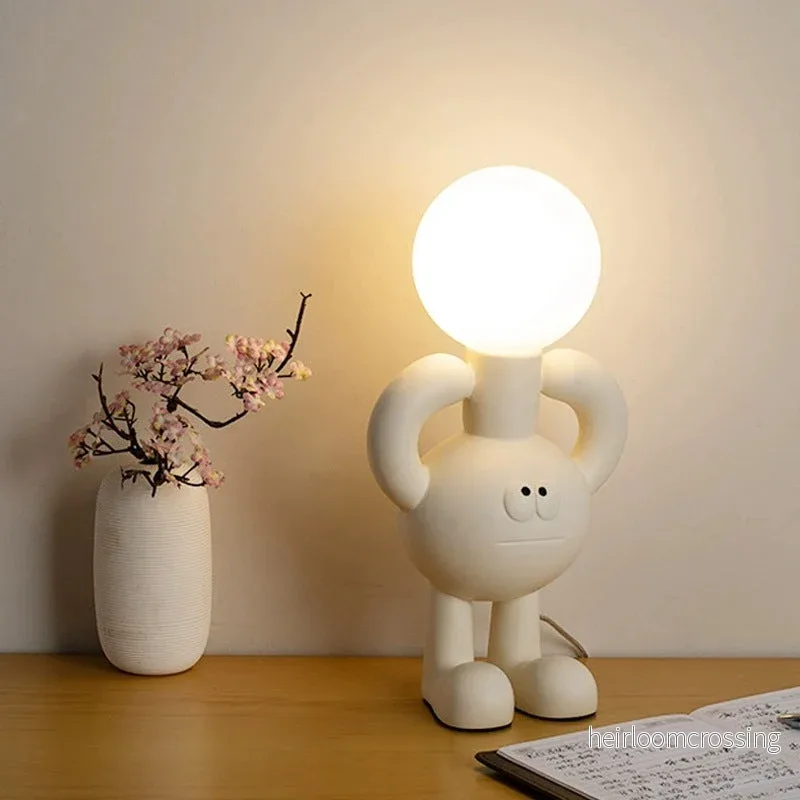 Lekfull bordslampa med glaskula – Glombra